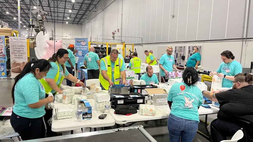 Perfetti group wrapping diapers for Coverd Greater Cincinnati nonprofit.