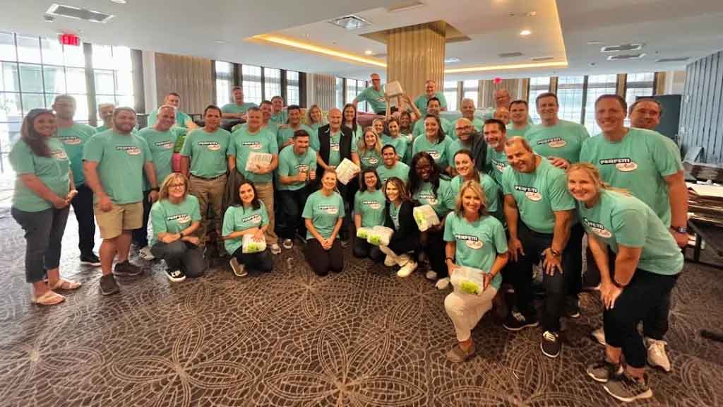 Large volunteer group after wrapping diapers.