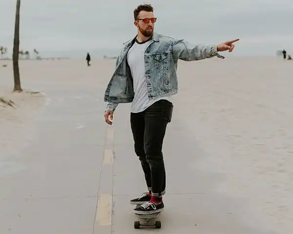 Man on skateboard pointing