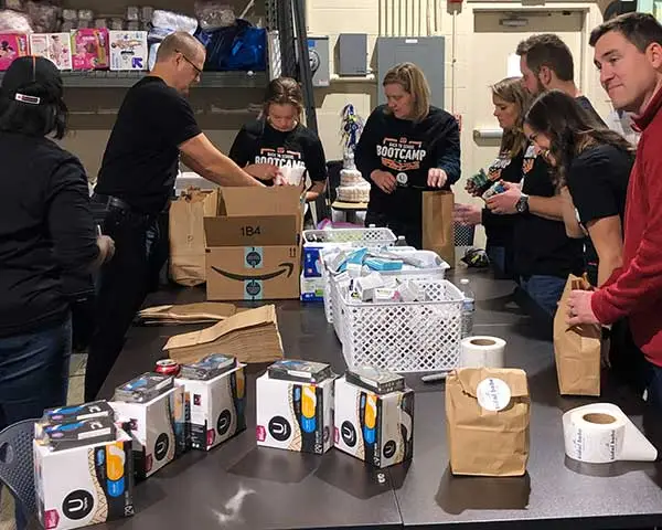 Volunteers preparing free period product kits to be distributed through our partner agencies.